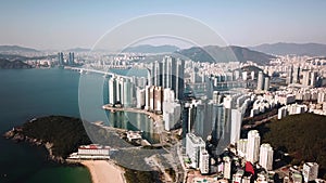 Aerial view of the cityscape in Haeundae, LCT and Haeundae beach in Busan.