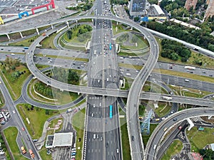 Aerial view cityscape of large streets. Car traffic on the highway in the big city.