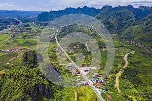 Aerial view of cityscape and nature with green fields and mountains in Chi Lang, Lang Son, Vietnam
