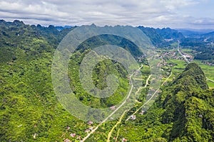 Aerial view of cityscape and nature with green fields and mountains in Chi Lang, Lang Son, Vietnam