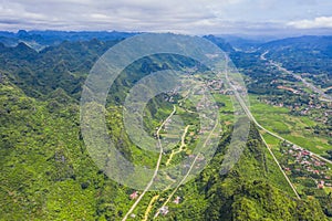 Aerial view of cityscape and nature with green fields and mountains in Chi Lang, Lang Son, Vietnam