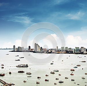 Aerial view cityspace of Pattaya city in Thailand with sea, bay and many ships