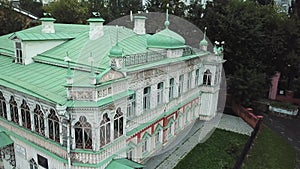 Aerial view of a classic merchant house of IX century. Stock footage. Restored white two storey architectural building