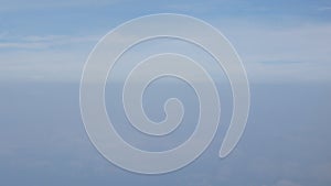 Aerial view of clear blue sky with some cloud while flying over sky in daytime, View from the window of the plane