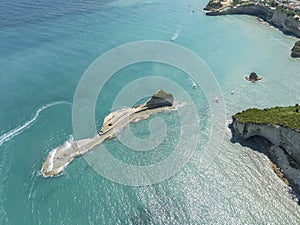 Aerial view of the cliff overlooking the sea near Apotripiti beach and of Mermaid`s rock. Corfu island. Greece