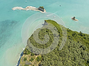 Aerial view of the cliff overlooking the sea near Apotripiti beach and of Mermaid`s rock. Corfu island. Greece