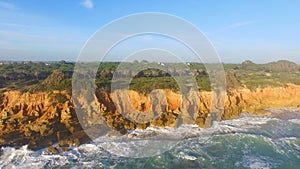 Aerial view of cliff and the sea with waves