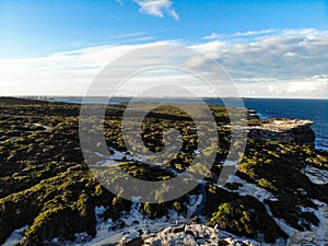 Aerial view of the cliff by the water