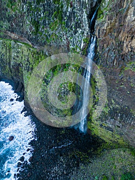 Aerial view of the cliffside and Corrego da Furna waterfall. Madeira, Portugal