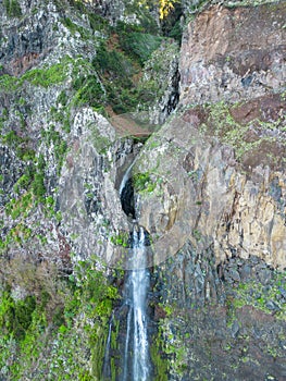 Aerial view of the cliffside and Corrego da Furna waterfall. Madeira, Portugal