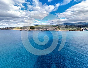 Aerial view of cloud and blue water in Alghero shoreline