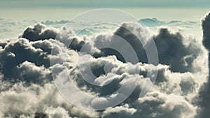 Aerial view of clouds around mountain peaks