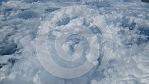 Aerial view of clouds, blue sunny sky, bird's-eye view.