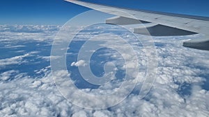 Aerial view of clouds, blue sunny sky, bird's-eye view.