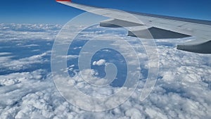 Aerial view of clouds, blue sunny sky, bird's-eye view.