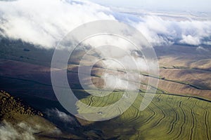 Aerial view of clouds and grasslands of North Kenya, Africa near Lewa Wildlife Conservancy