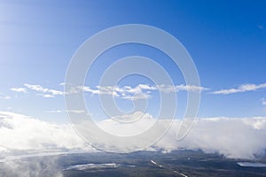 Aerial view clouds over the forest and lake. View from drone. Aerial top view cloudscape. Texture of clouds. View from above. Sunr