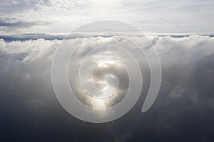 Aerial view clouds over the sea. View from drone. Aerial top view cloudscape. Texture of clouds. View from above. Sunrise or