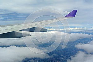 Aerial view Clouds and sky as seen through window of an aircraft