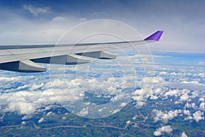 Aerial view Clouds and sky as seen through window of an aircraft