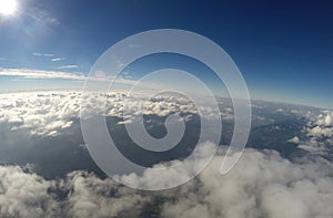 Aerial View - Clouds, Sun and Blue Sky