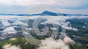 Aerial view through clouds to the city of Dolny Kubin