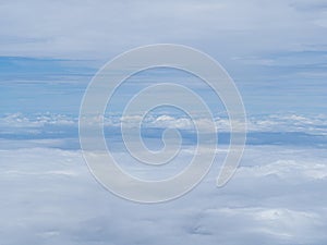 Aerial view of cloudscape seen through airplane window