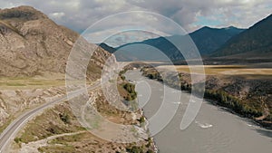 Aerial view cloudy day view road near river surrounded altay mountains