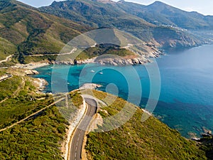 Aerial view of the coast of Corsica, winding roads and cove. Gulf of Aliso. France photo