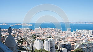 Aerial view of coast at Marseille in a sunny day with city, sea and mountains