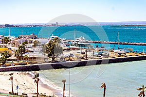 Aerial view of coastal beach with Marina Atalanta