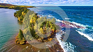 Aerial View of Coastal Forest Peninsula and Waves in Lake Superior photo