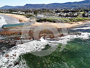 Aerial view of a coastal rock pool and beach in Austinmer, New South Wales, Australia photo