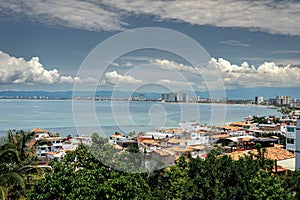 Aerial view of a coastal village in Puerto Vallarta , Mexico under a cloudy sky