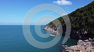 An aerial view of the coastline of a beautiful tropical island