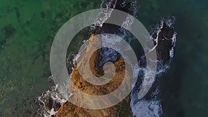 Aerial View of Coastline Rising Up With Person Walking