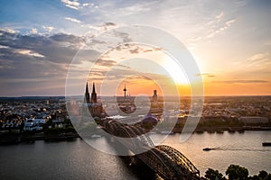 Aerial view of Cologne Cathedral and Hohenzollern Bridge at sunset, Germany