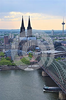 Cologne Cathedral and Hohenzollern Bridge aerial view at dusk, Germany