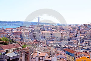 Aerial view with colored houses and the 25 abril bridge in Lisbon Portugal