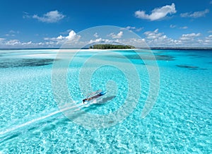 Aerial view of colorful boat, sandbank, blue sea on sunny day