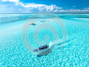 Aerial view of colorful boats, sandbank, blue sea on sunny day