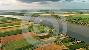 Aerial view of colorful fields on bank of Danube