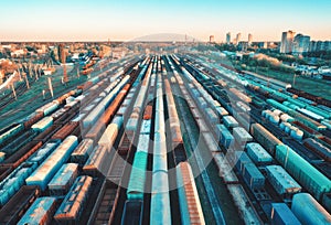 Aerial view of colorful freight trains on railway station