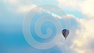 Aerial View Of Colorful Hot Air Balloon Flying Against The Scenic Cloudy Blue Sky