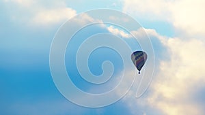 Aerial View Of Colorful Hot Air Balloon Flying Against The Scenic Cloudy Blue Sky