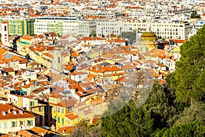 Aerial view of the colorful rooftops and trees in Nice old town in France