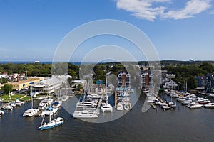 Aerial view of colorful sailboat moorings and docks on azure blue Spa Creek, in historic downtown Annapolis Maryland on a sunny su