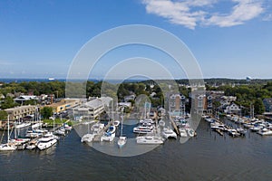 Aerial view of colorful sailboat moorings and docks on azure blue Spa Creek, in historic downtown Annapolis Maryland on a sunny su