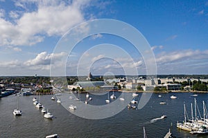 Aerial view of colorful sailboat moorings and docks on azure blue Spa Creek, in historic downtown Annapolis Maryland on a sunny su