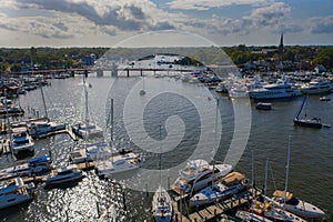 Aerial view of colorful sailboat moorings and docks on azure blue Spa Creek, in historic downtown Annapolis Maryland on a sunny su